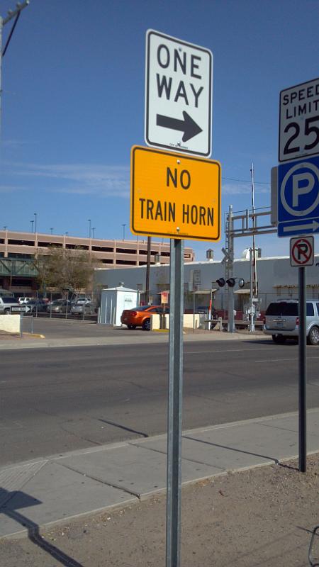 2013-07-07_15-54-05_353.jpg - This is sign is posted in a parking lot a little ways from a railroad crossing. No train engineer can see this sign, so is if for the cars who have train horns?