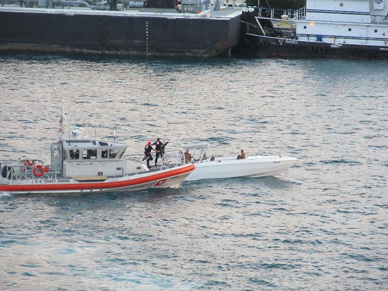 IMG_0643.JPG - Leaving Port of Miami - US Coast Guard stopped a boat.  Machine gun mounted on the front.